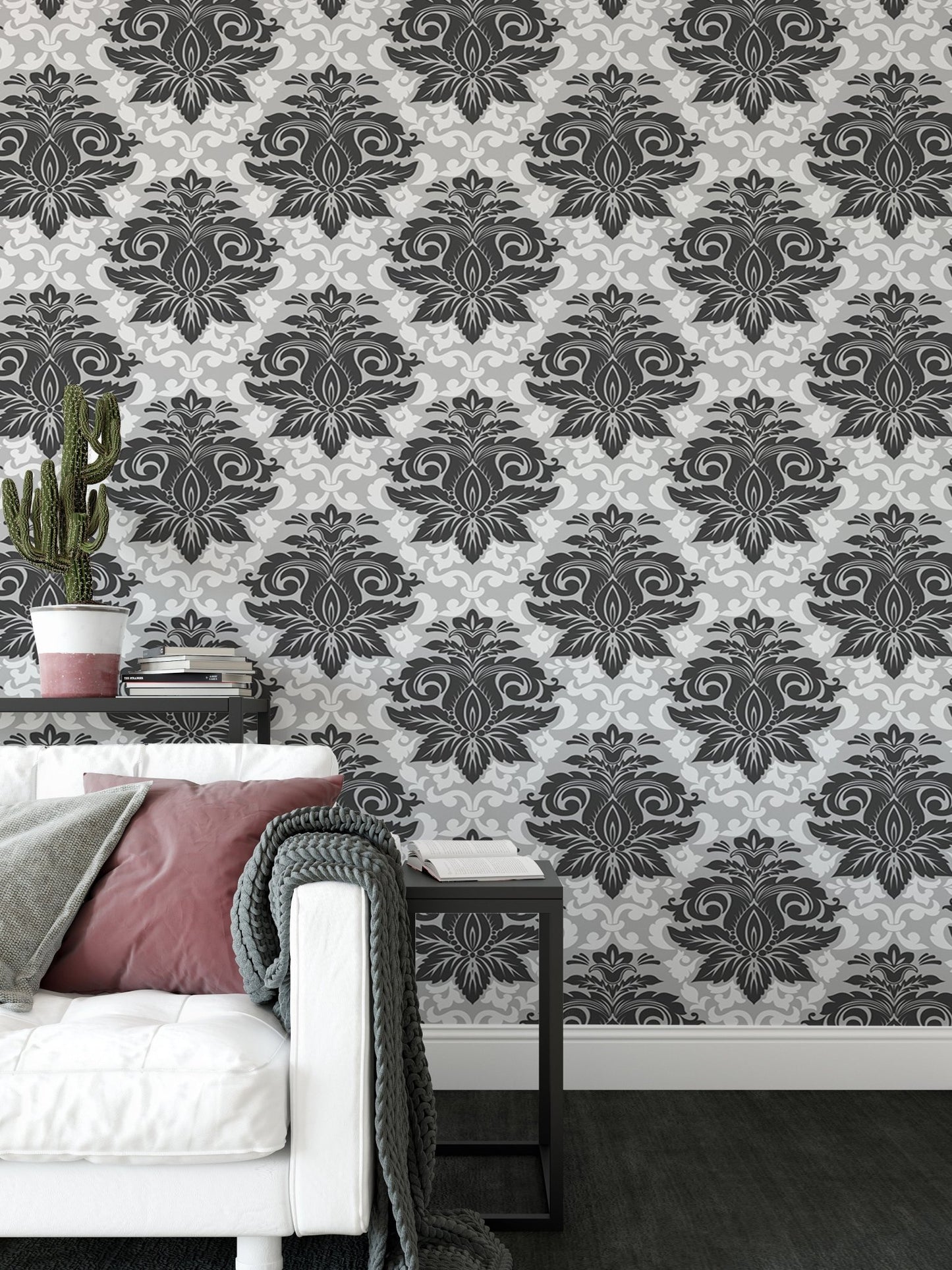Black and white damask wallpaper in a modern living beside a white sofa.