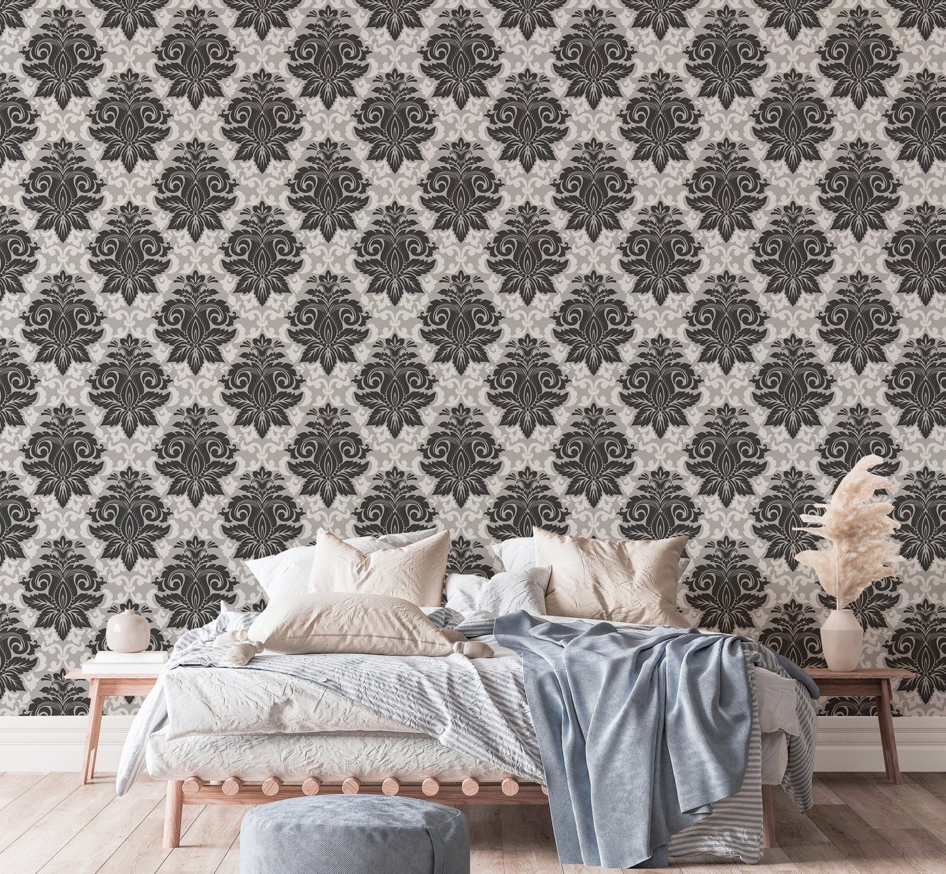 Textured greyish damask wallpaper in a bedroom setting with blue bedding.