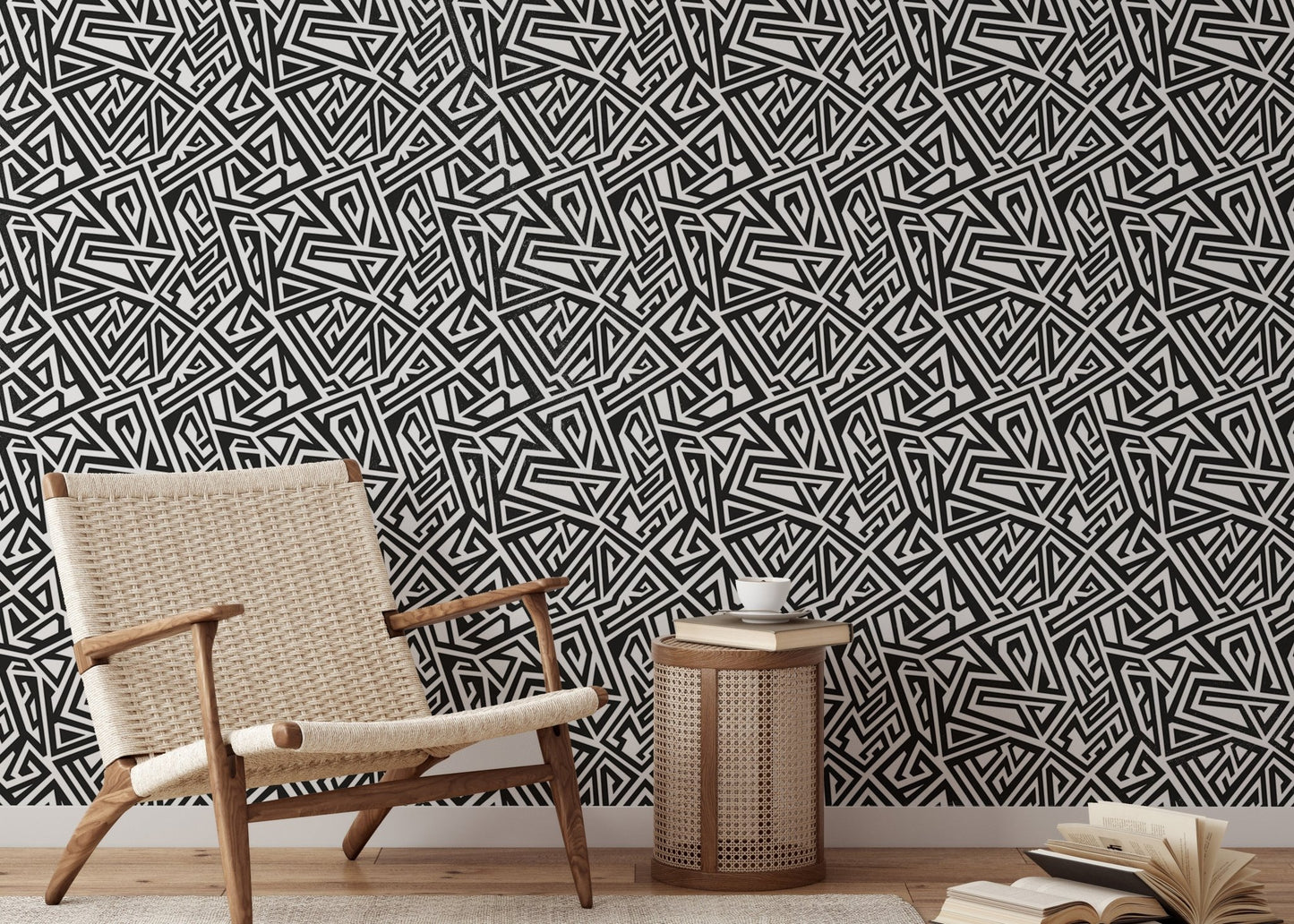 Minimalist reading area showing black and white ancient geometric wallpaper.