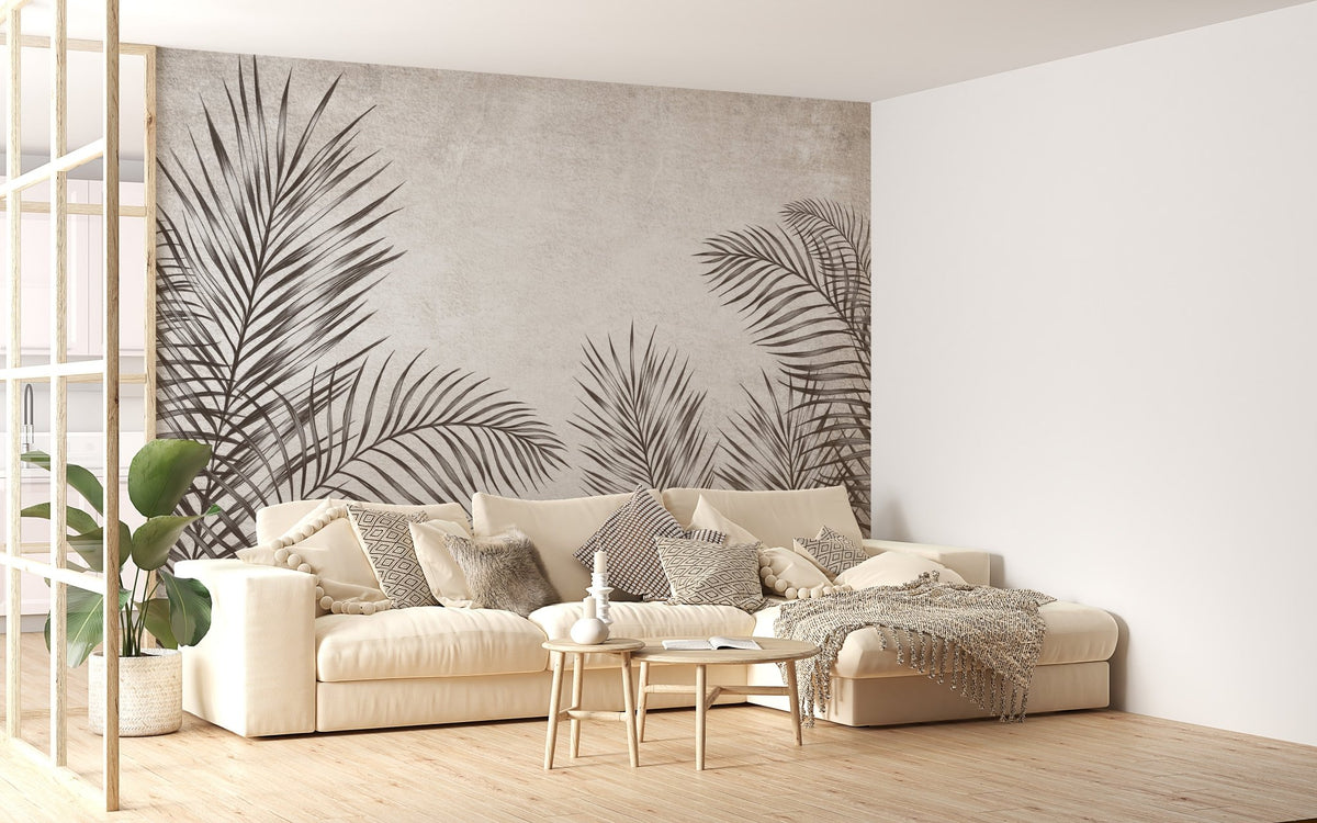 Black and White Palm Leaves Wall Murals behind a beige sofa in a living room.