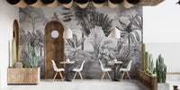 Black and white mountain scenery wall mural in a cafe with tables and chairs.