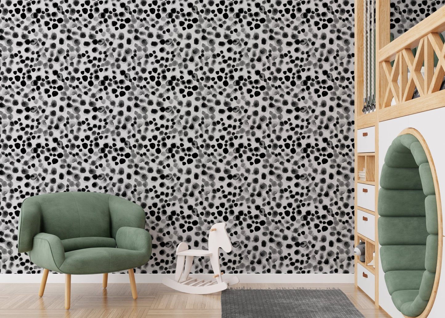 Geometric watercolor wallpaper used in a kids play area with a green chair.