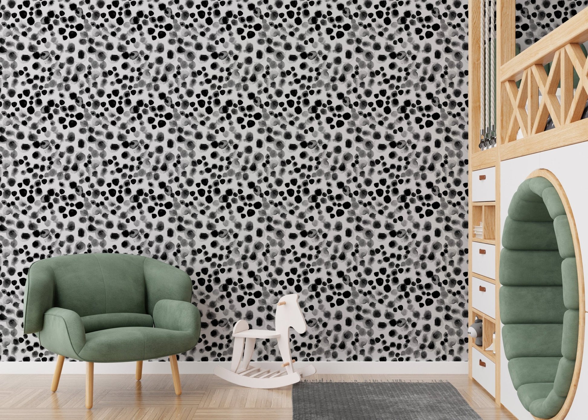 Geometric watercolor wallpaper used in a kids play area with a green chair.