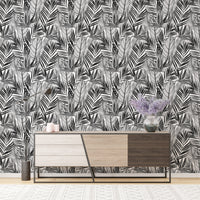 Watercolor wallpaper in modern room with dark wood console table.