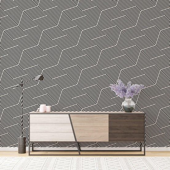 Minimalist stripe wallpaper behind a wooden sideboard and purple vase.