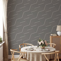 Textured grey and white pattern wallpaper on a dining room feature wall.