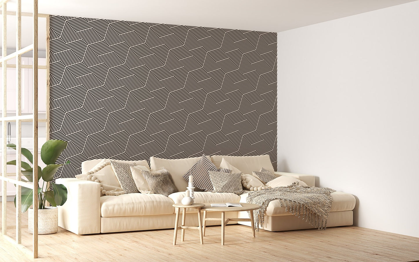 Large scale geometric wallpaper in a living room with an ivory sofa.