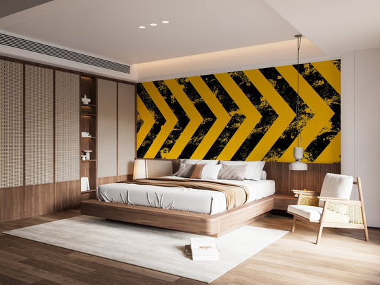 Contemporary bedroom with black and yellow hazard strips wall mural feature
