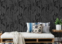 Daybed with pillows against a charcoal geometric pattern wallpaper