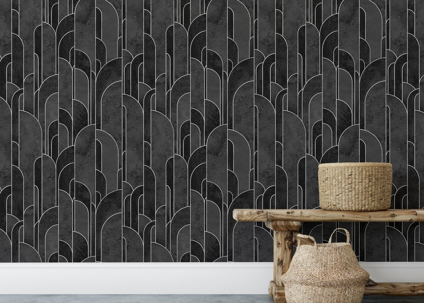 Wooden bench with woven baskets against a dark pattern wallpaper.