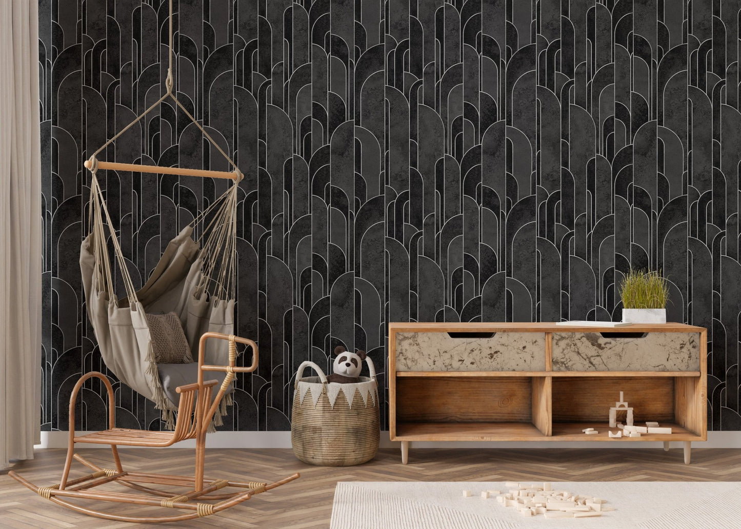 Wooden furniture and hanging chair with a charcoal black wallpaper in nursery.