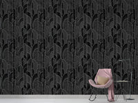 Minimalist space with a pink chair and dark archway pattern wallpaper