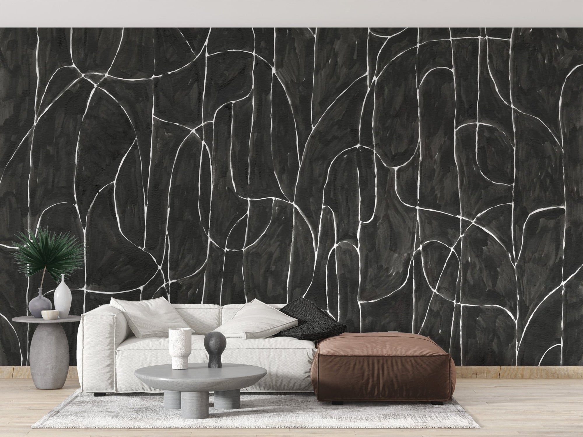 Black boulder beach wallpaper featuring stark white interlocking curves.