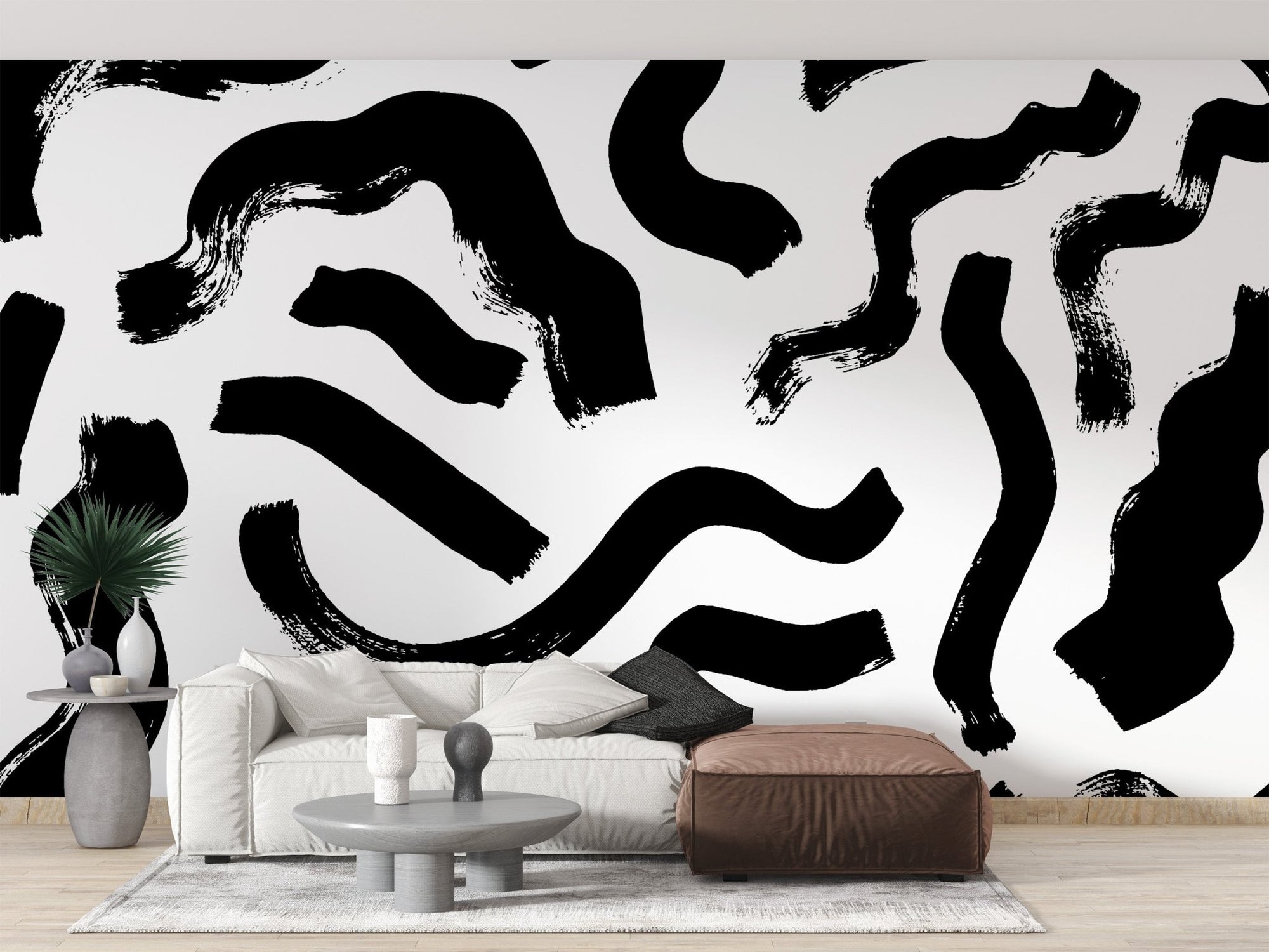 Black brushstrokes abstract wall mural with bold ink swirls on white.