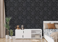 Dark charcoal damask wallpaper in a bedroom with white storage cabinets.
