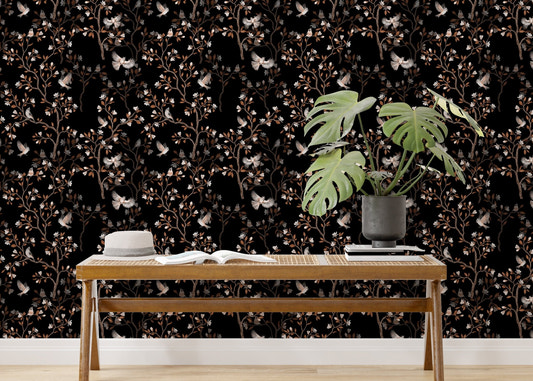Black Color Chinoiserie Repeat Pattern Magnolia Tree Birds Wallpaper behind a wooden bench.