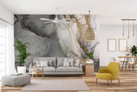 Black and gold ink wall mural for modern sophisticated decor in open living space.
