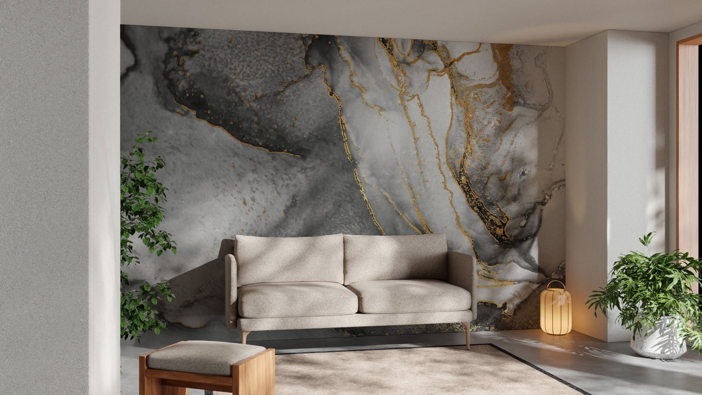 Abstract black gold ink mural with flowing artistic design in living room.
