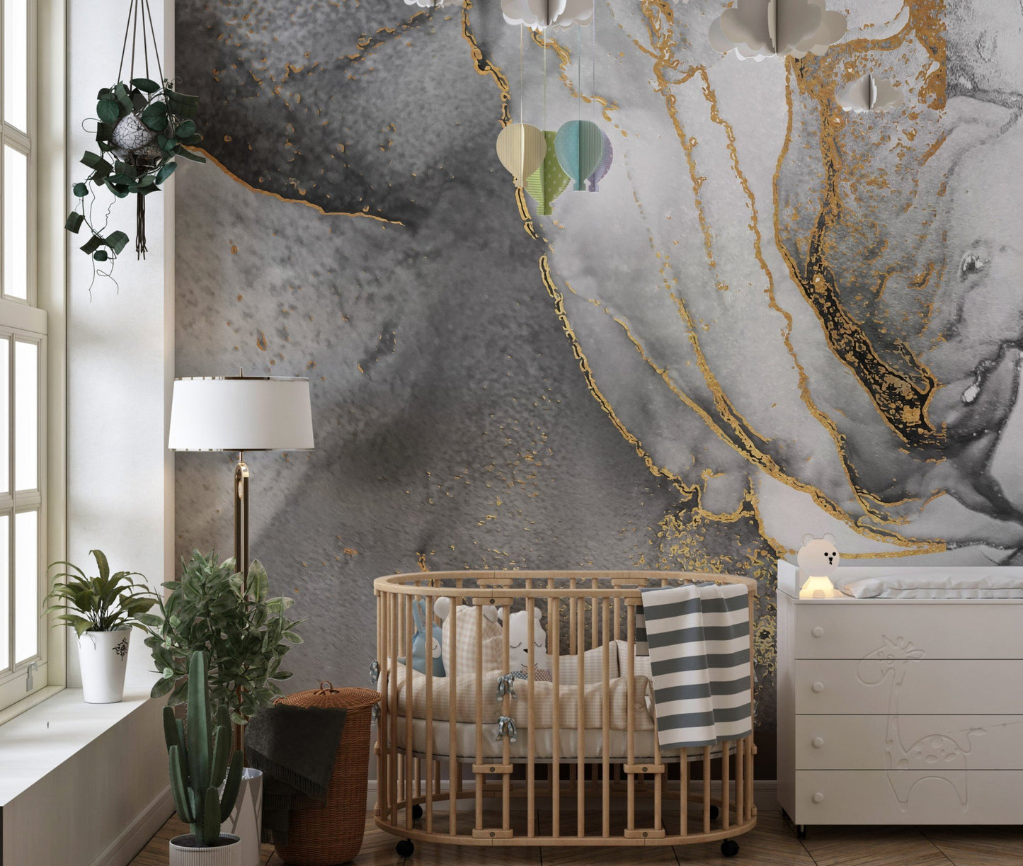 Abstract mural with black and gold ink fusion for stylish nursery walls.
