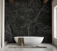 Luxury bathroom setting with dark textured wall mural and wooden accents.