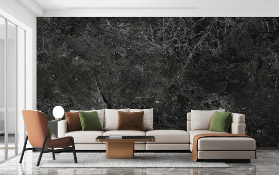Minimalist living room with a black marble textured wallpaper mural and neutral sofa.