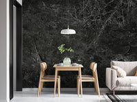 Small dining nook featuring a dark marble wallpaper mural and hanging pendant light.