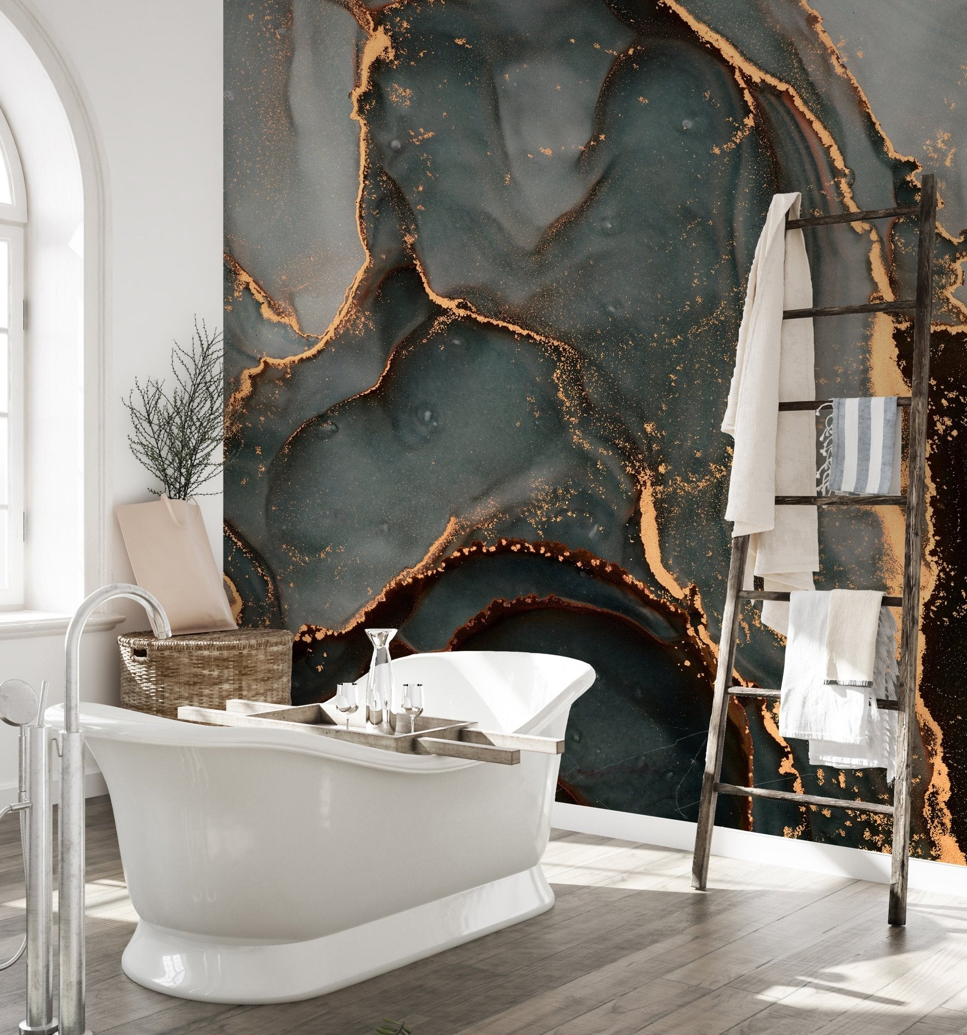 Grey and gold abstract wall mural in a bright bathroom with natural light.