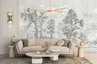 Hand-painted style tree wall mural behind a cream sofa with gold lighting.