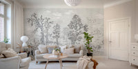 Monochrome tree wall mural behind a beige sofa in a contemporary living room.