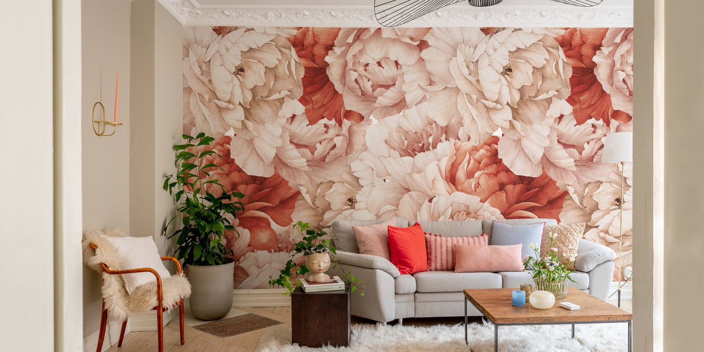Large peony floral wall mural in a living room with a grey sofa and indoor plants.