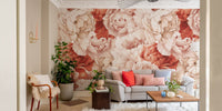 Large peony floral wall mural in a living room with a grey sofa and indoor plants.