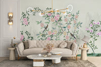 Cream sectional sofa in front of a pink flower garden wall mural.