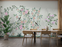 Dining area with wooden table and botanical bird trails wall mural.
