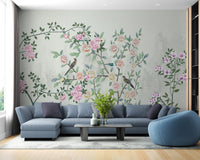 Large blue sofa paired with a vintage style floral garden wall mural.