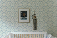 Victorian-style wallpaper in blue and beige tones for feature wall.