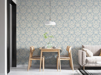 Classic wallpaper with blue and beige victorian motifs in dining area.