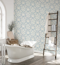 Victorian wallpaper pattern applied in a modern bathroom.