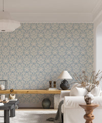 Living room decorated with a blue and beige floral wallpaper.