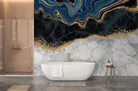 Deep blue and gold marbled wall mural in a sunlit bathroom interior.