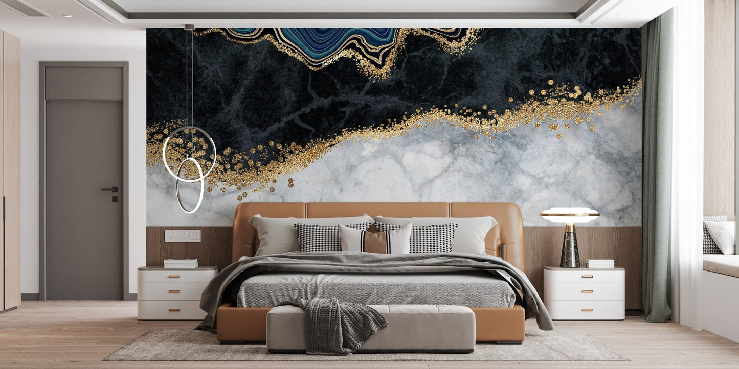 Dark blue marble wall mural with gold veins behind a large master bed.