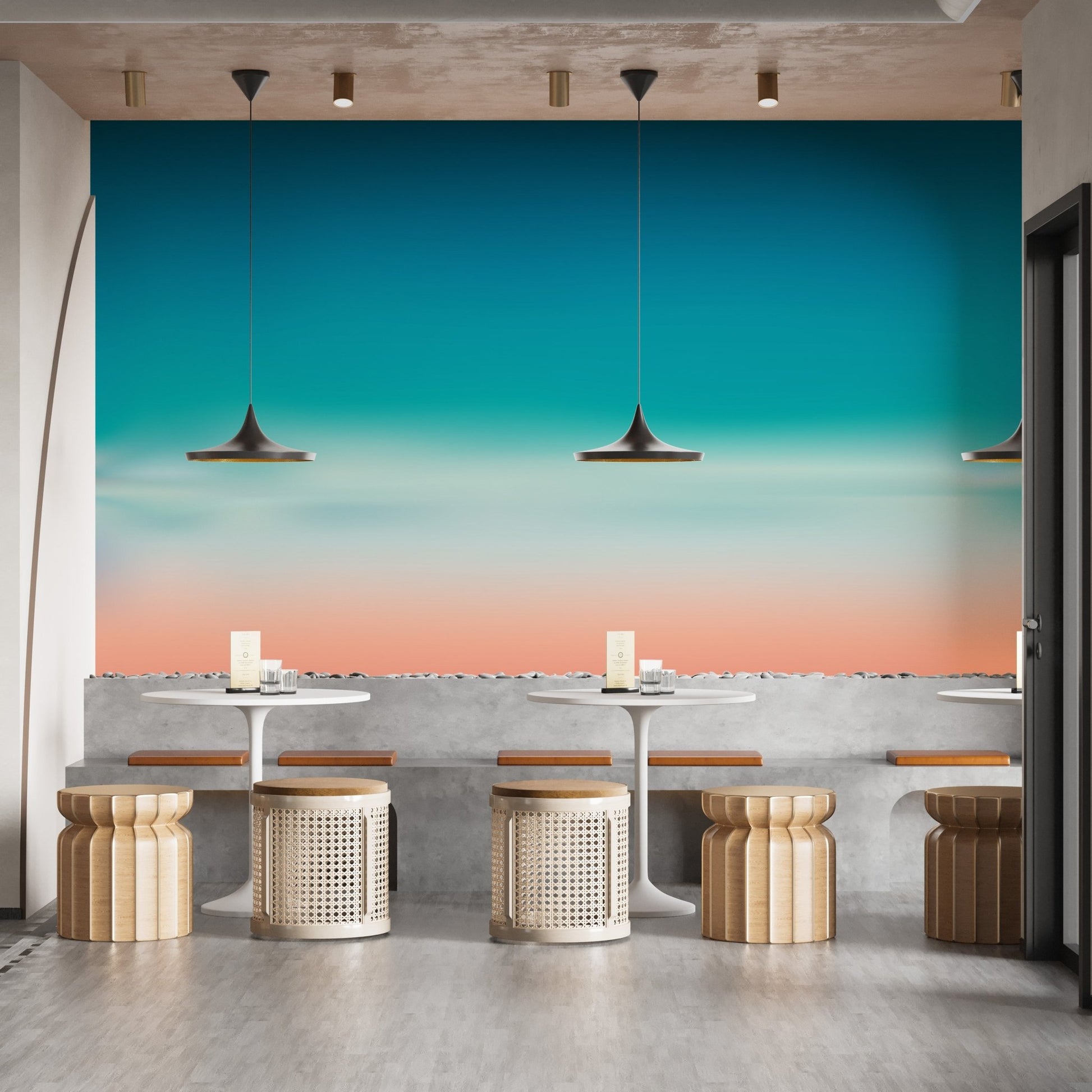 Blue-pink blurred sea mural for relaxing room vibes in cafe area.