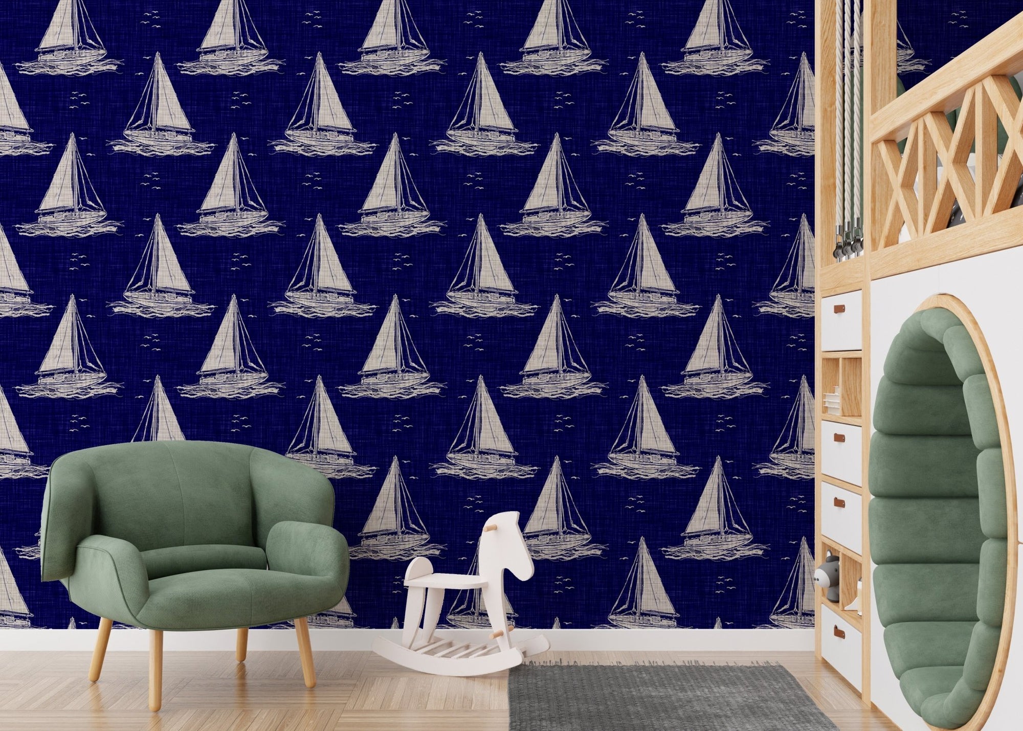 Blue and white nautical navy sailing boat wallpaper in a playroom with green armchair.