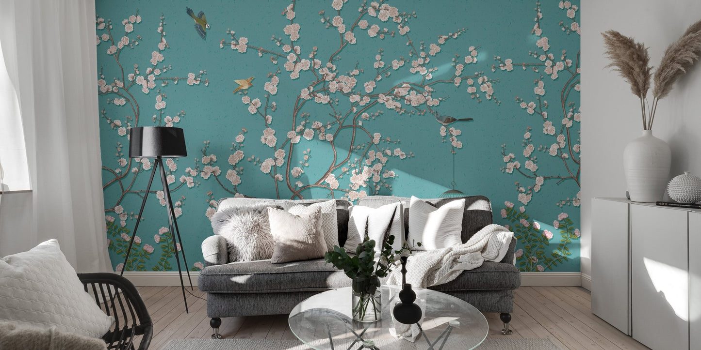 Contemporary sitting room with teal flower wall mural and a dark accent chair.