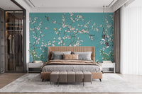 Master bedroom suite featuring pink flower wall mural on a teal surface.