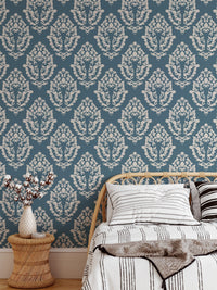 Traditional damask wallpaper design in a bright, airy bedroom.