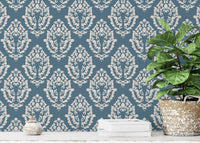 Premium vector damask wallpaper behind a reading space with palnt.