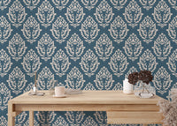 Classic blue floral damask wallpaper in a reading room setting.