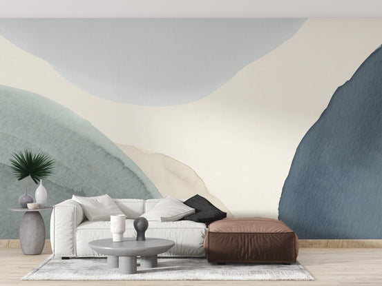 Soft calming watercolor wallpaper mural in muted blue and green tones.