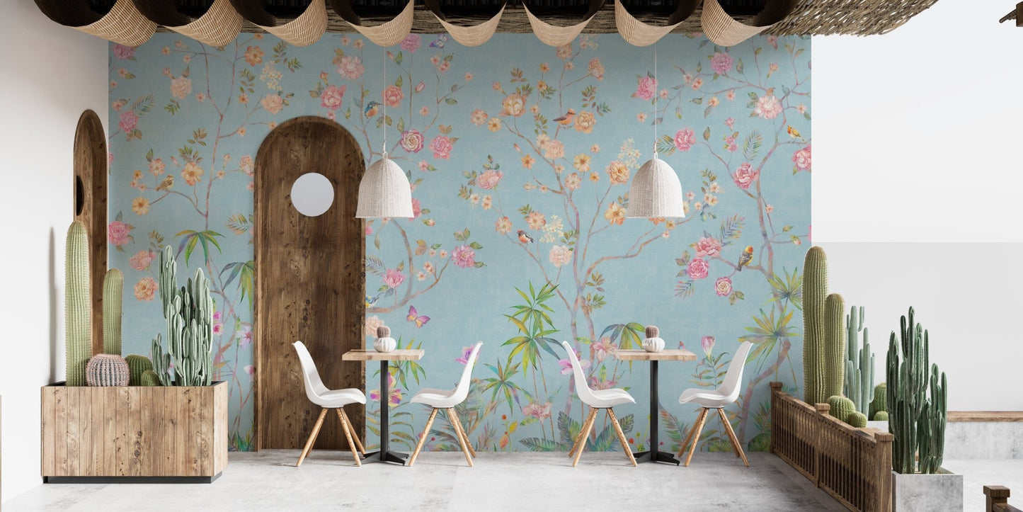 Cafe seating area featuring floral elegance wall mural and wooden accents.