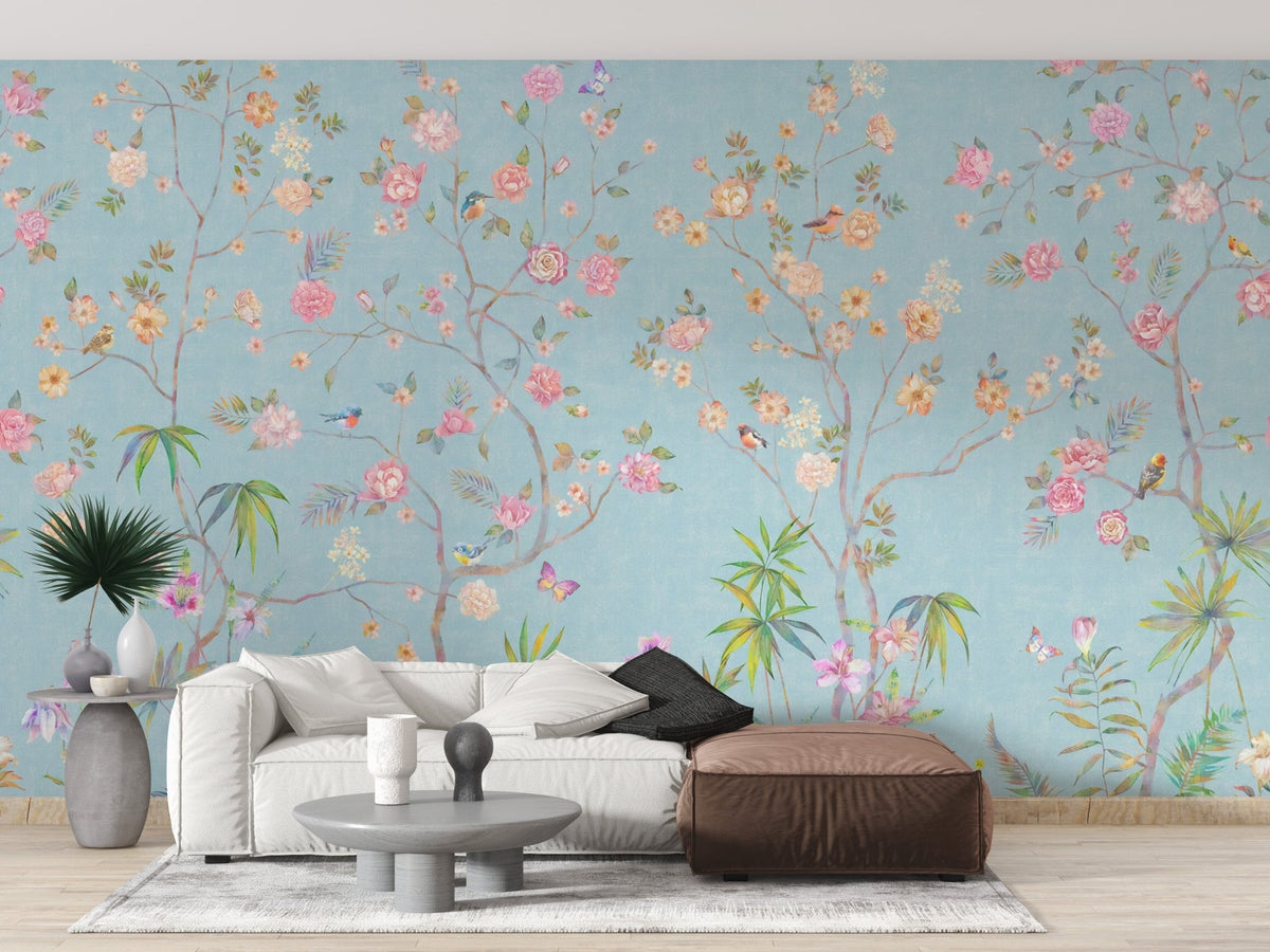 Living area featuring a light blue floral wall mural with a brown chaise living room.